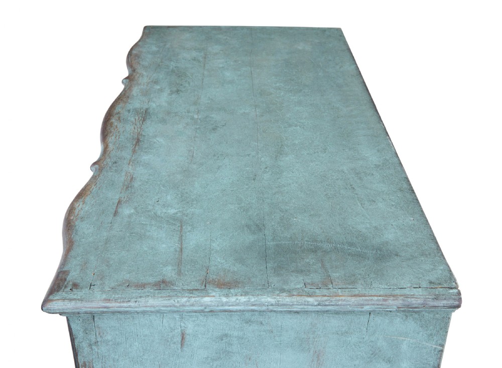 An 18th-century Scandinavian Baroque chest of drawers with four long drawers, brass handles, and a distressed blue-green painted finish. View II