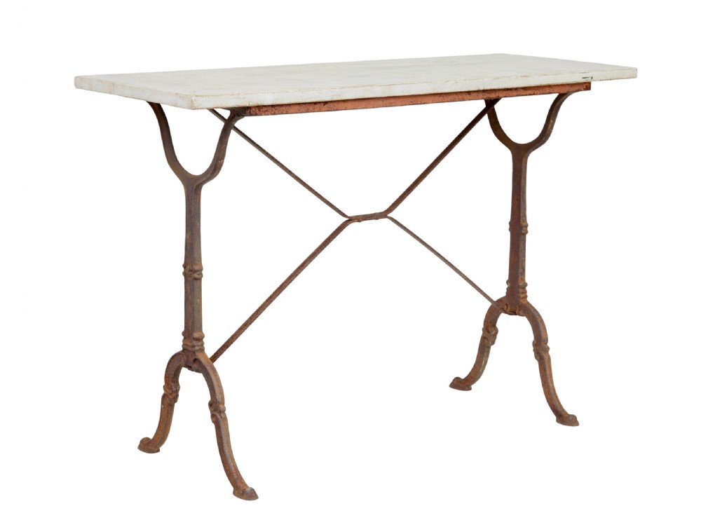 A late 19th-century French side table with a rectangular white marble top set on an oxidised rust-brown cast iron frame with X-bracing.
