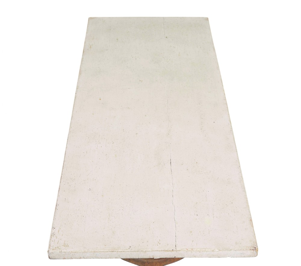 A late 19th-century French side table with a rectangular white marble top set on an oxidised rust-brown cast iron frame with X-bracing. View II