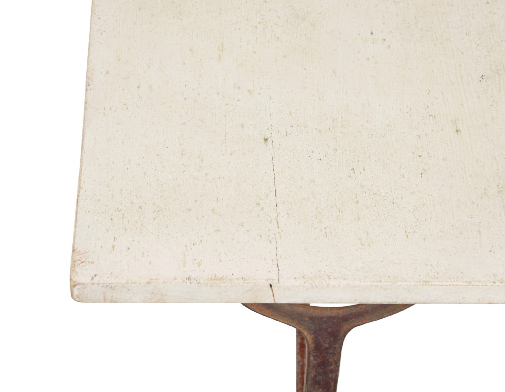A late 19th-century French side table with a rectangular white marble top set on an oxidised rust-brown cast iron frame with X-bracing. View VI