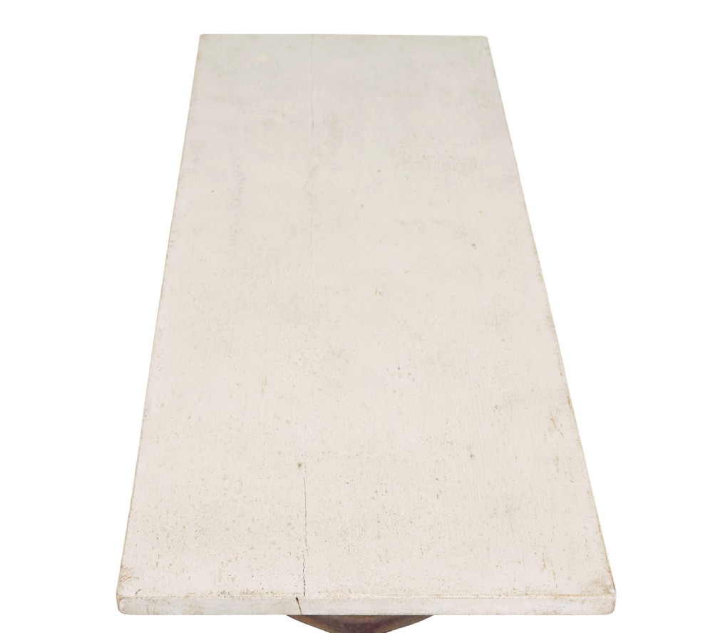 A late 19th-century French side table with a rectangular white marble top set on an oxidised rust-brown cast iron frame with X-bracing. View VII