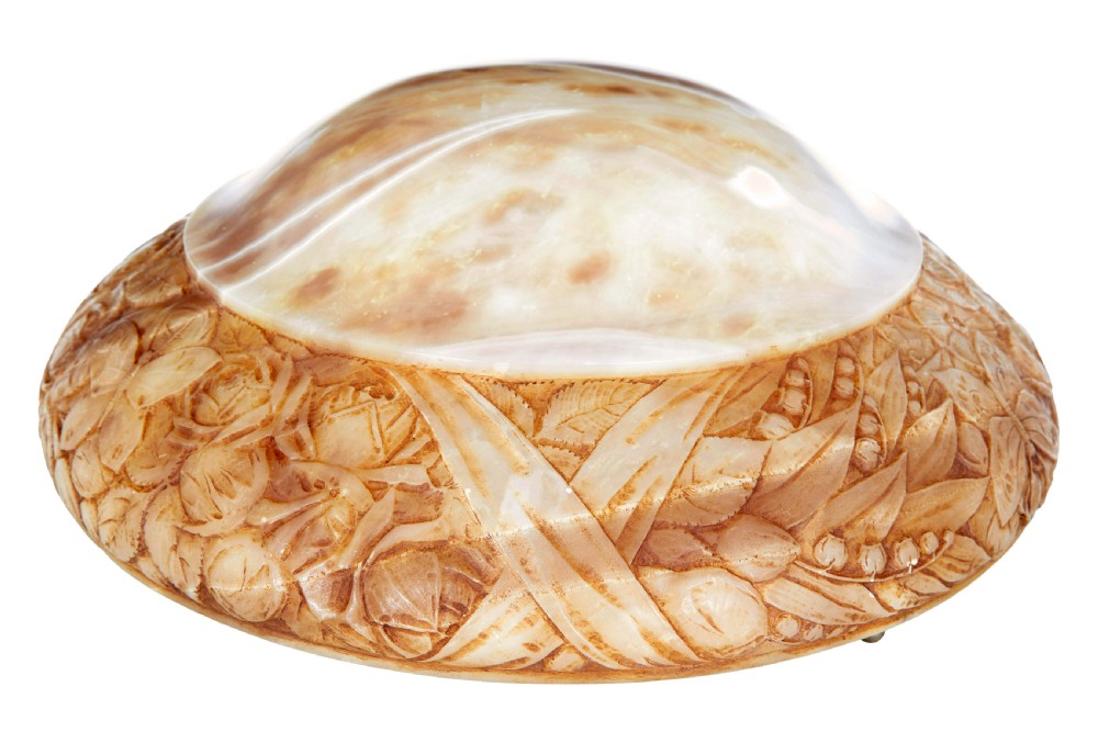 A carved warm amber alabaster ceiling bowl light suspended by three woven cords with a textured canopy. View II