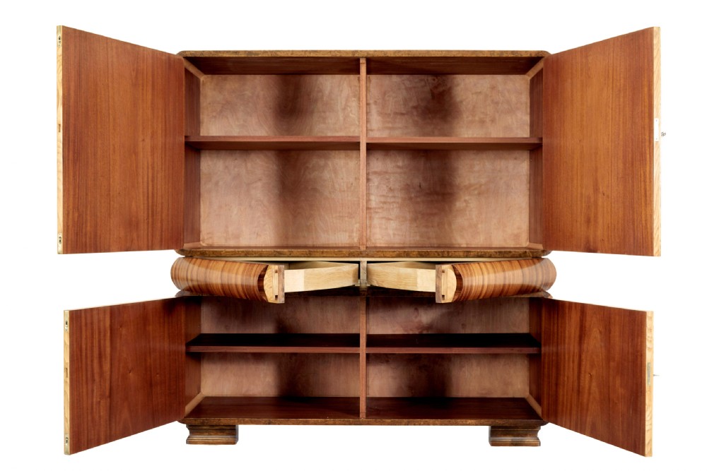 A Scandinavian Art Deco cabinet in blonde birch and elm veneer with two upper doors, a central reeded waist band, and two lower doors. View III