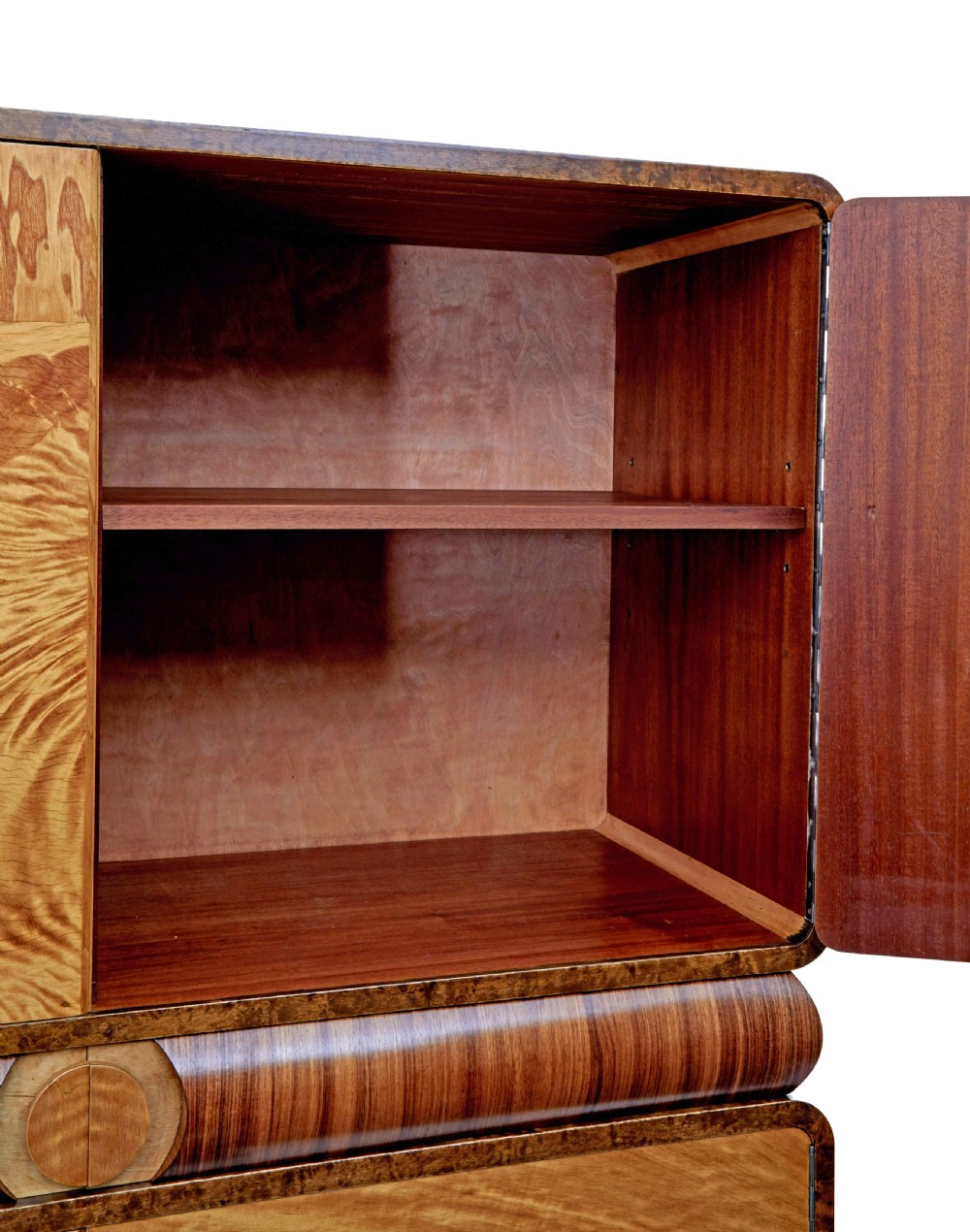 A Scandinavian Art Deco cabinet in blonde birch and elm veneer with two upper doors, a central reeded waist band, and two lower doors. View XII