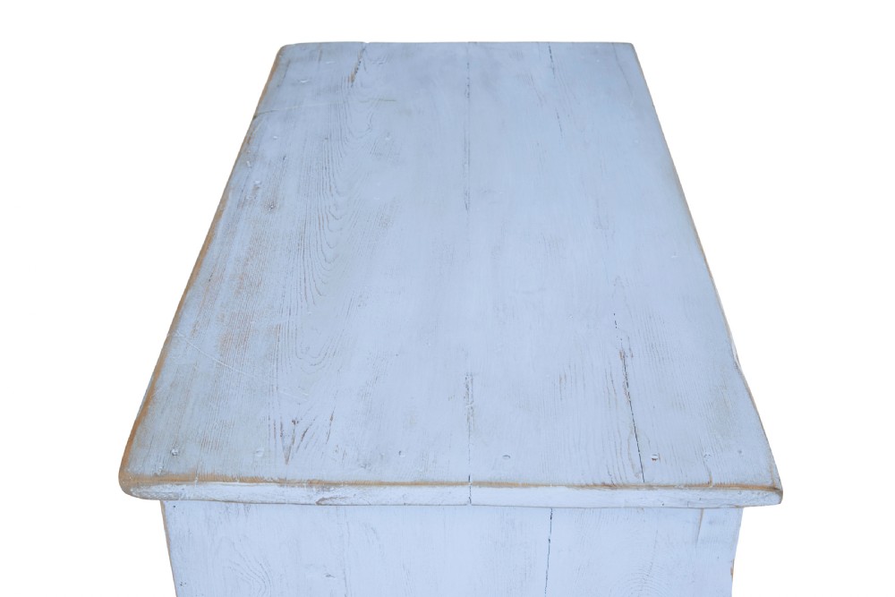 A 19th-century light blue painted pine two-door cupboard featuring reeded door panels with raised oval details and short turned feet. View II