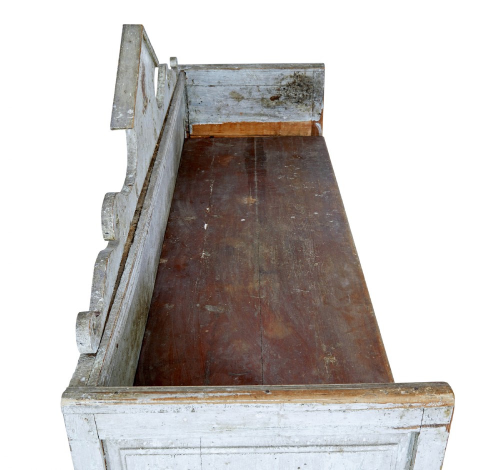 An early 19th-century Swedish Gustavian bench in distressed grey paint featuring a pedimented backrest and tapered legs. View VII