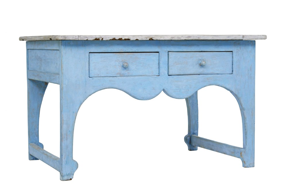 A mid 19th-century Swedish pine side table painted light blue with two drawers, wooden knobs, and an arched lower apron.