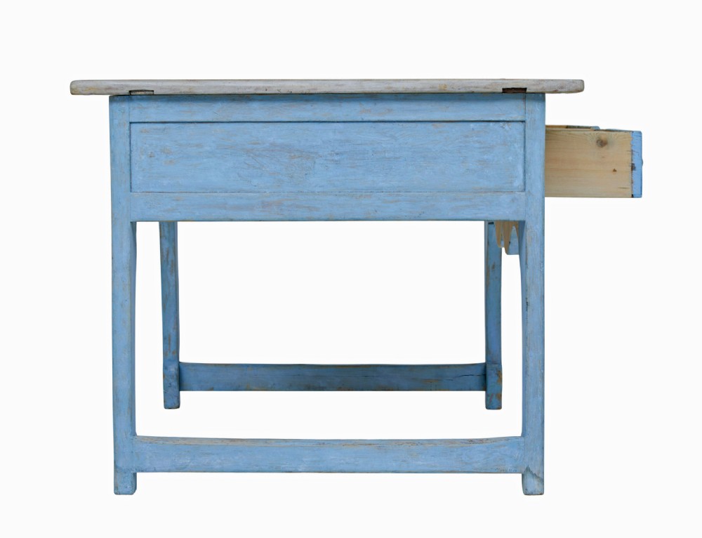 A mid 19th-century Swedish pine side table painted light blue with two drawers, wooden knobs, and an arched lower apron. View III