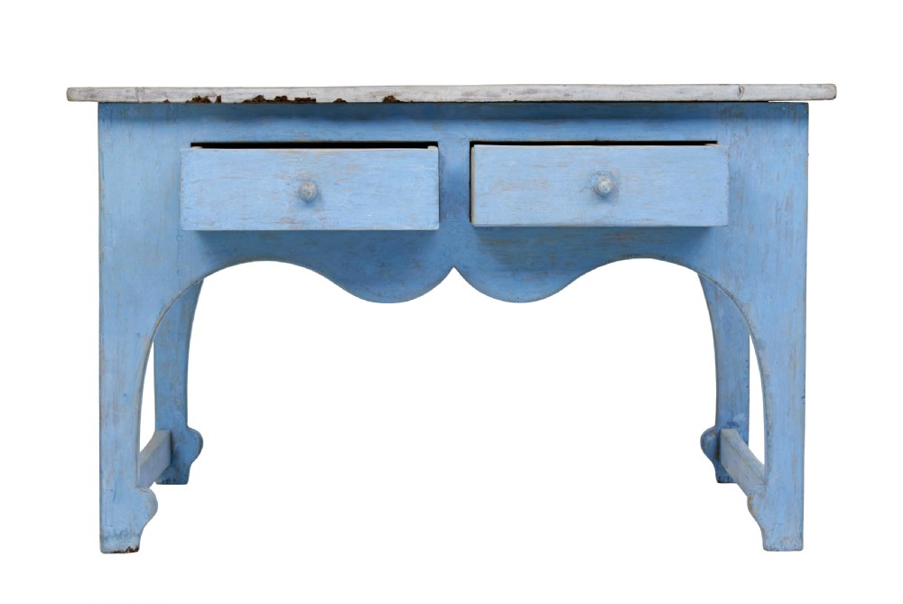 A mid 19th-century Swedish pine side table painted light blue with two drawers, wooden knobs, and an arched lower apron. View IV