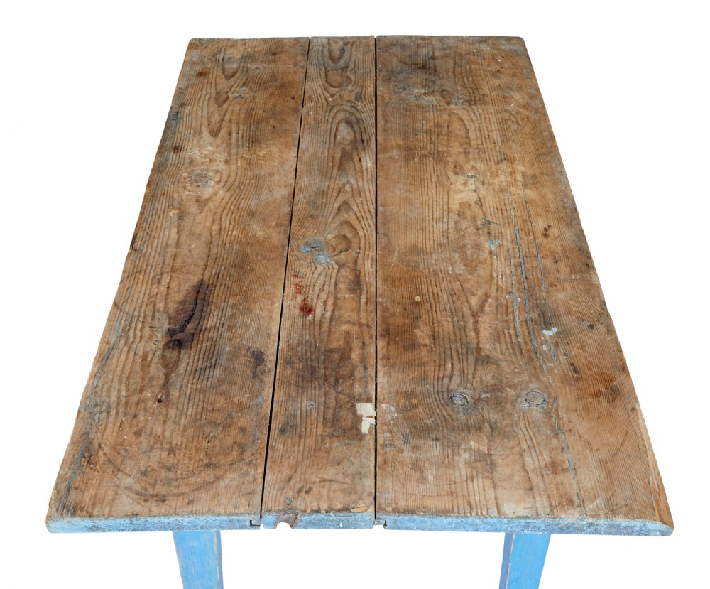 A 19th-century rustic side table featuring a blue painted apron and tapered legs with an unpainted natural pine plank top. View III
