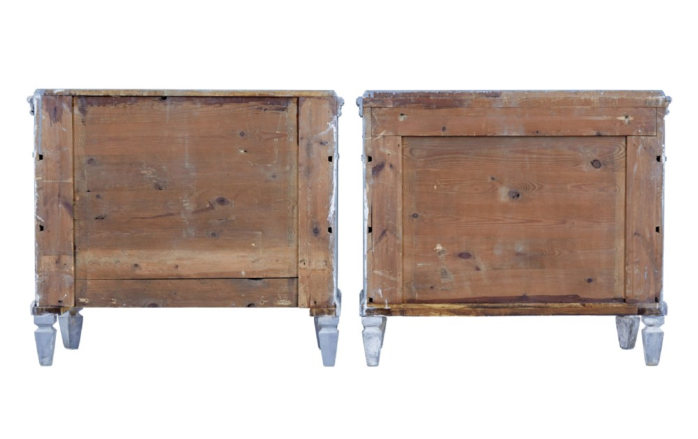 A pair of 19th-century light blue painted Swedish chests of drawers featuring three drawers, fluted sides, circular brass pull handles, and brass shield escutcheons. View V