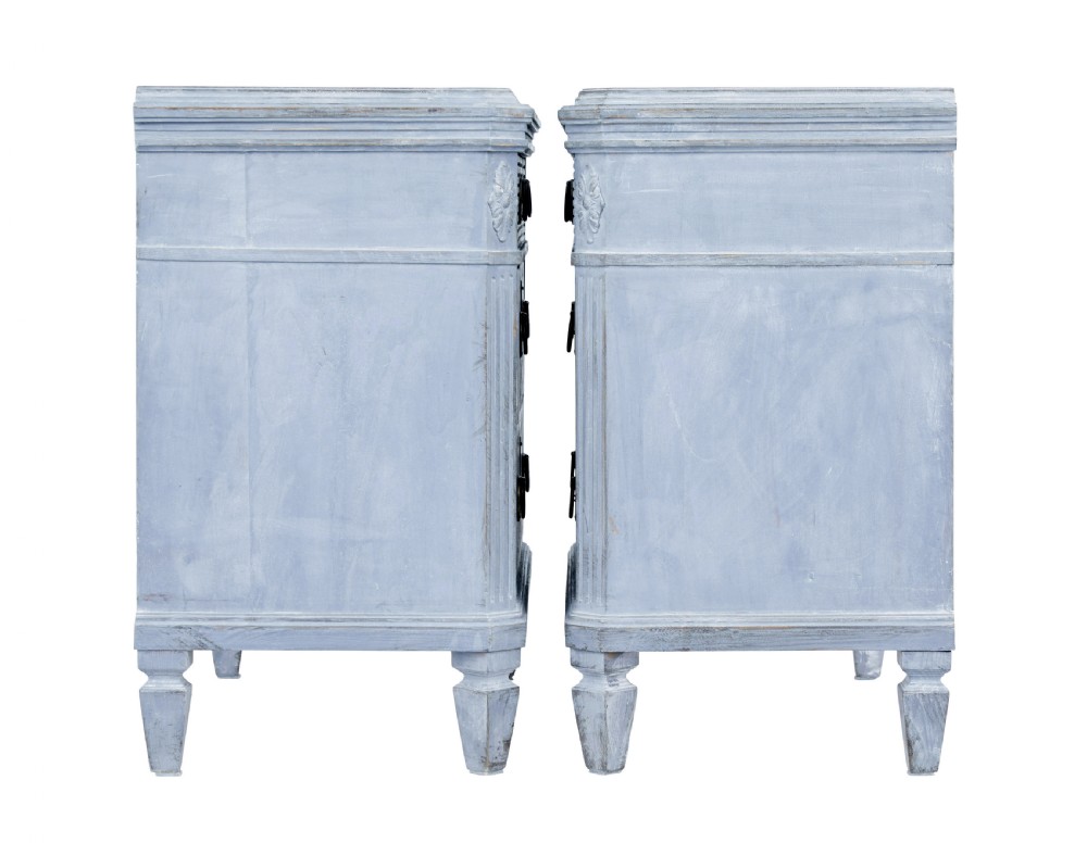 A pair of 19th-century light blue painted Swedish chests of drawers featuring three drawers, fluted sides, circular brass pull handles, and brass shield escutcheons. View VI