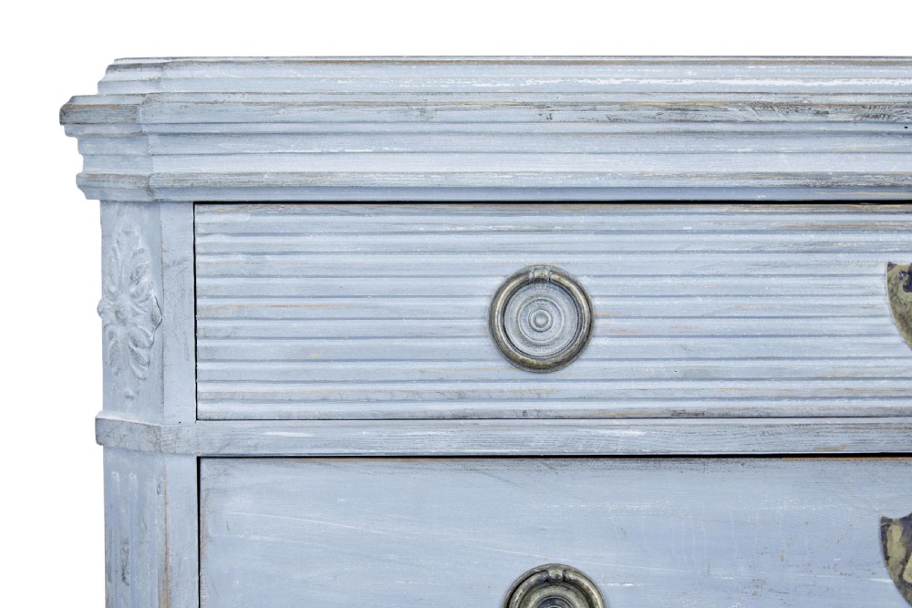 A pair of 19th-century light blue painted Swedish chests of drawers featuring three drawers, fluted sides, circular brass pull handles, and brass shield escutcheons. View VII