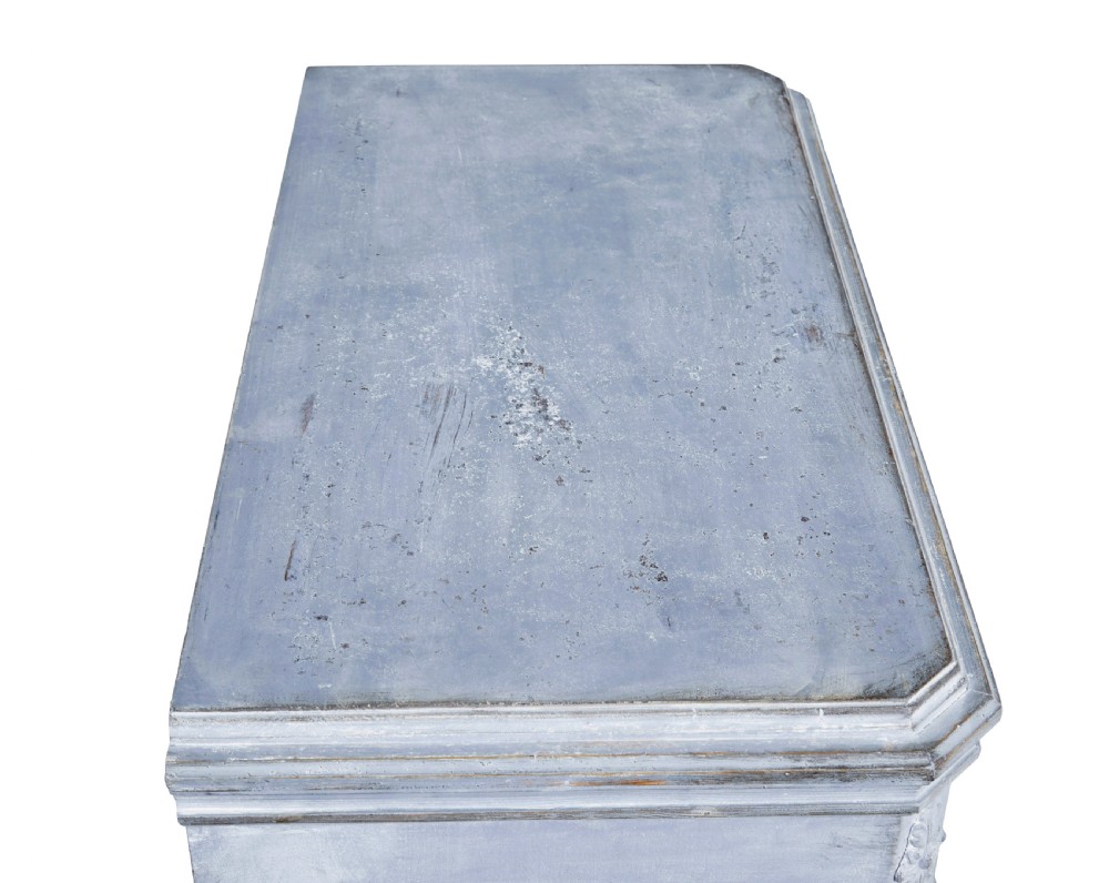 A pair of 19th-century light blue painted Swedish chests of drawers featuring three drawers, fluted sides, circular brass pull handles, and brass shield escutcheons. View IX