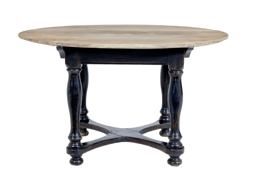 A rustic 19th-century circular occasional table featuring a natural wood top, a dark painted base with a single drawer, turned legs, and an X-shaped cross-stretcher. View IV