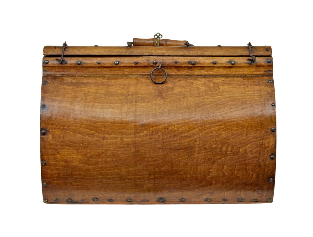 An early 20th-century Scandinavian wooden doctors bag featuring a curved timber body reinforced with iron rivets, a brass lock, and a turned wooden carry handle. View II