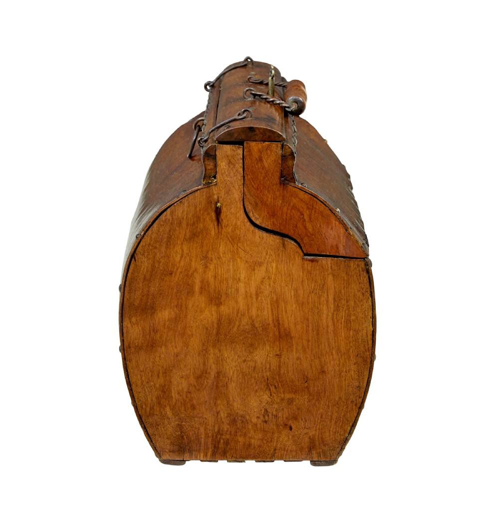 An early 20th-century Scandinavian wooden doctors bag featuring a curved timber body reinforced with iron rivets, a brass lock, and a turned wooden carry handle. View III
