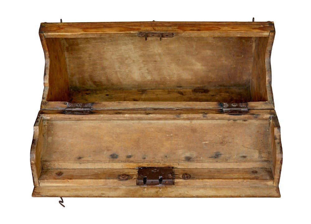 An early 20th-century Scandinavian wooden doctors bag featuring a curved timber body reinforced with iron rivets, a brass lock, and a turned wooden carry handle. View VII