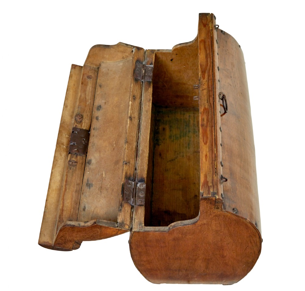 An early 20th-century Scandinavian wooden doctors bag featuring a curved timber body reinforced with iron rivets, a brass lock, and a turned wooden carry handle. View VIII