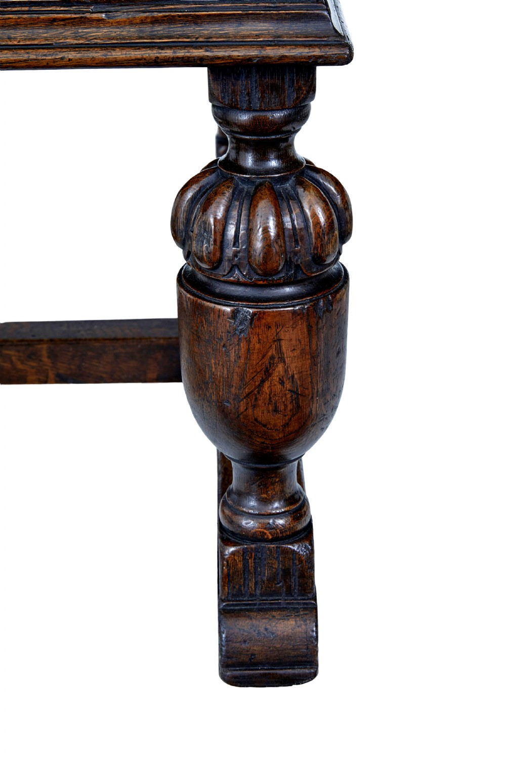 A late nineteenth-century Victorian dark carved oak pedestal desk featuring a leather writing surface, multiple drawers, and turned legs on stretcher bases. View IX