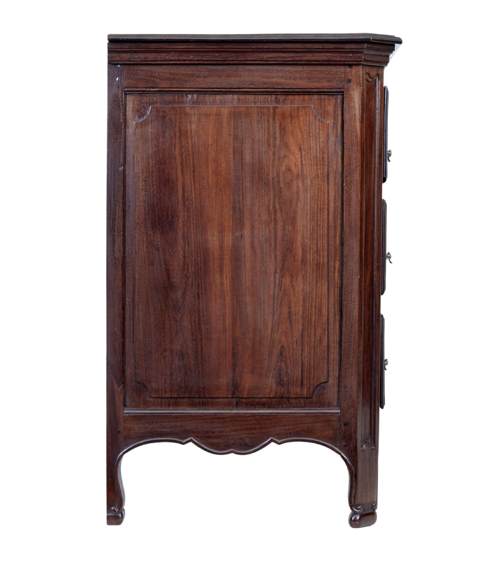 A 19th-century French Provincial walnut commode featuring three long carved drawers with brass handles and a scalloped lower apron. View VII