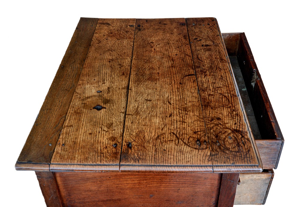 An early 18th-century Georgian oak side table featuring two drawers with brass drop handles, keyhole escutcheons, turned legs, and a box stretcher. View VIII