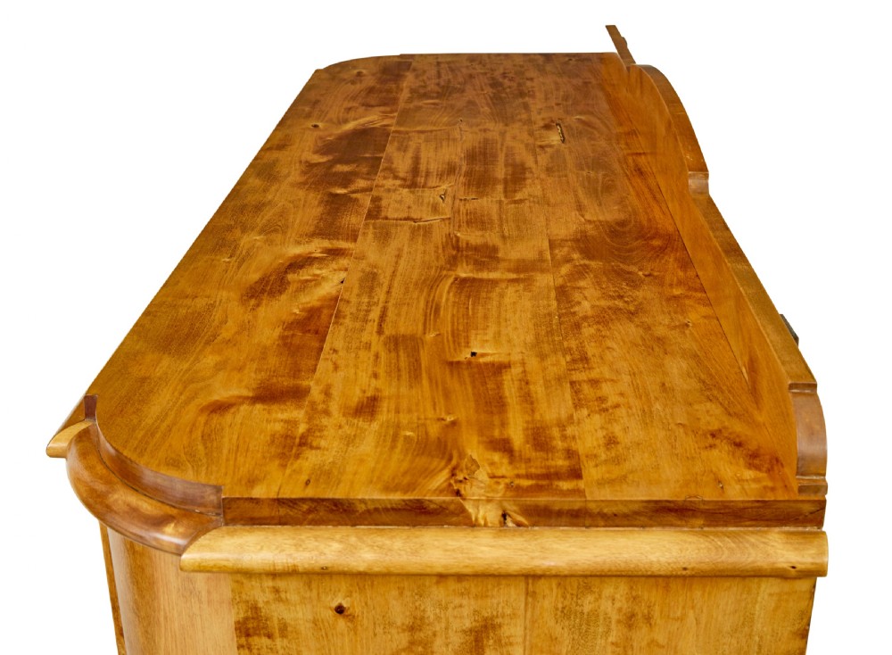 A mid-19th-century Swedish birch buffet sideboard featuring two top drawers, two cabinet doors, and curved side panels in a golden timber finish. View XI