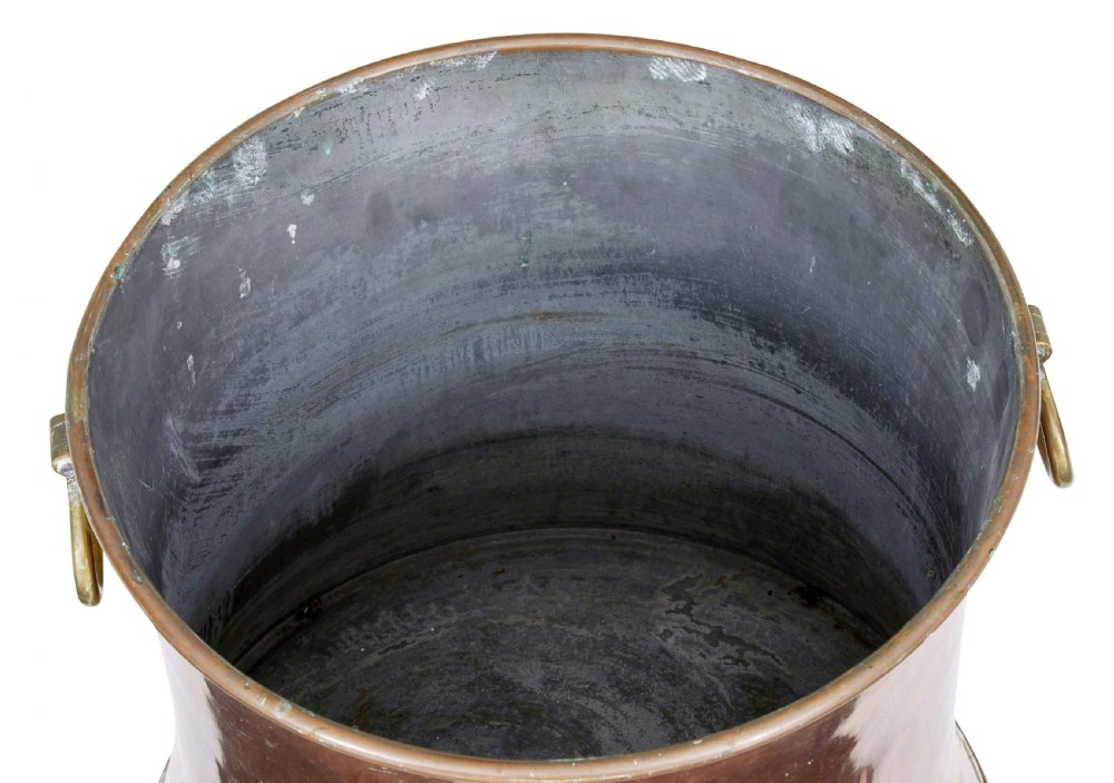 A 19th-century copper log bin featuring a flared, waisted silhouette, rolled rim, and cast brass ring handles. View II