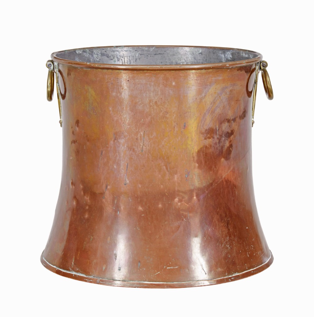 A 19th-century copper log bin featuring a flared, waisted silhouette, rolled rim, and cast brass ring handles. View IV