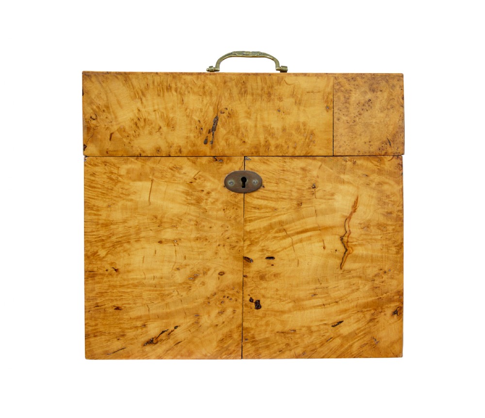 A 19th-century Swedish burr birch table box featuring prominent wood grain patterns, a top brass handle, and an oval brass escutcheon. View II
