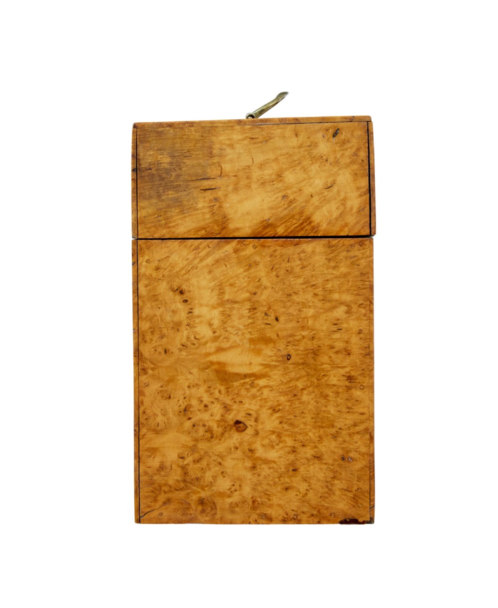 A 19th-century Swedish burr birch table box featuring prominent wood grain patterns, a top brass handle, and an oval brass escutcheon. View IV