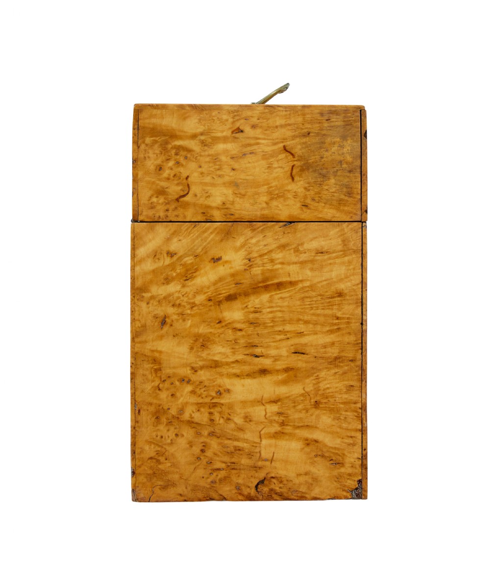 A 19th-century Swedish burr birch table box featuring prominent wood grain patterns, a top brass handle, and an oval brass escutcheon. View VI