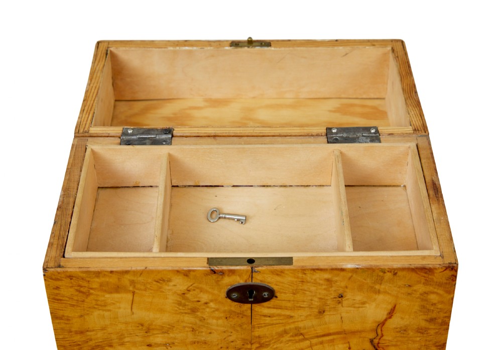 A 19th-century Swedish burr birch table box featuring prominent wood grain patterns, a top brass handle, and an oval brass escutcheon. View VIII