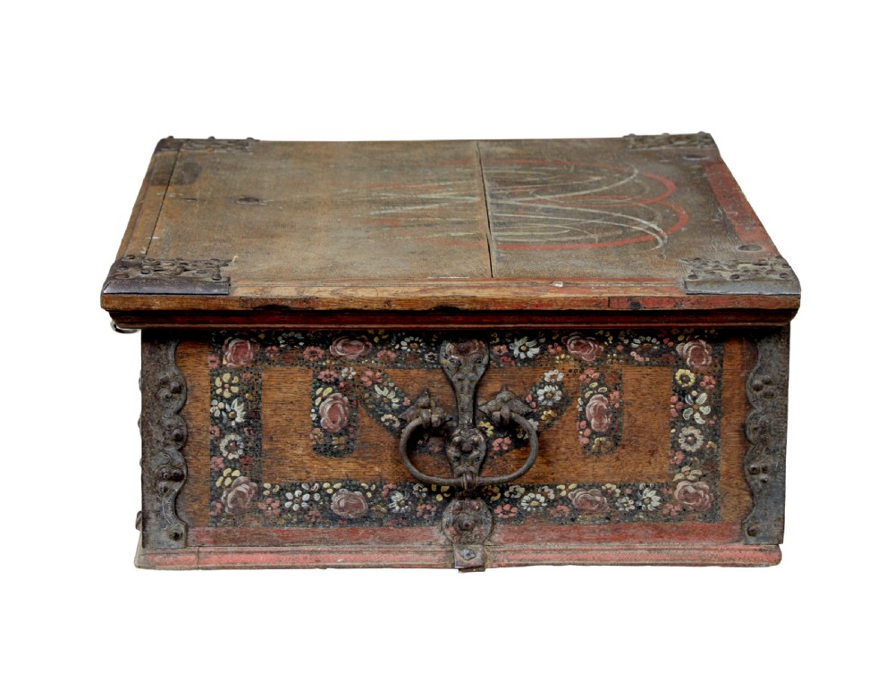 A 19th-century Swedish oak strongbox featuring wrought iron strapwork, side handles, and hand-painted floral motifs on the front panel. View IV