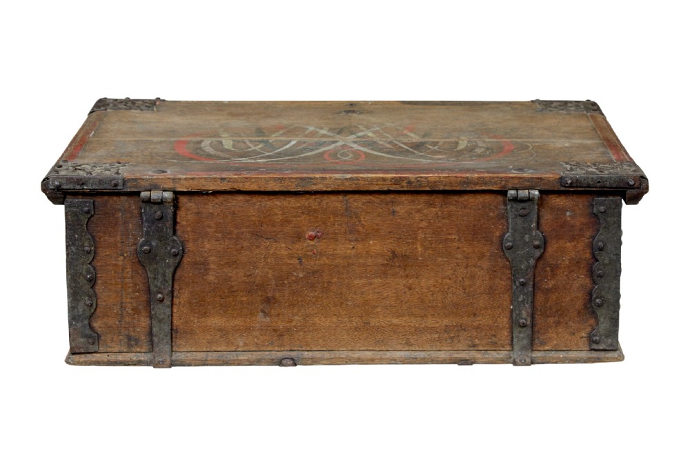 A 19th-century Swedish oak strongbox featuring wrought iron strapwork, side handles, and hand-painted floral motifs on the front panel. View V