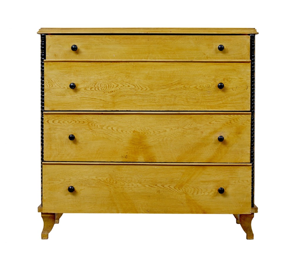 A mid-19th century Swedish northern pine chest of drawers featuring a yellow painted finish, four full-width drawers with black knobs, and black bobbin-turned corner columns. View VIII