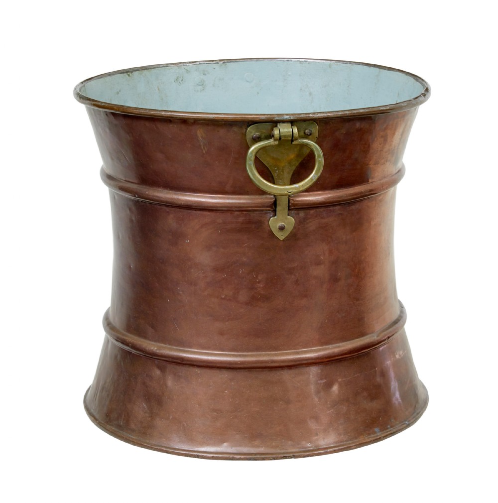A 19th-century waist-shaped copper bucket featuring brass side handles and a tin-lined interior.