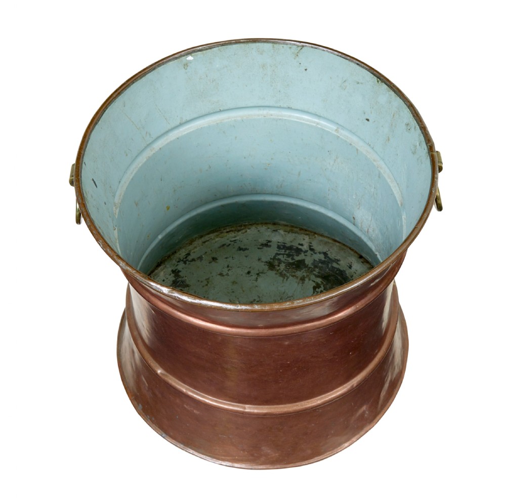 A 19th-century waist-shaped copper bucket featuring brass side handles and a tin-lined interior. View II