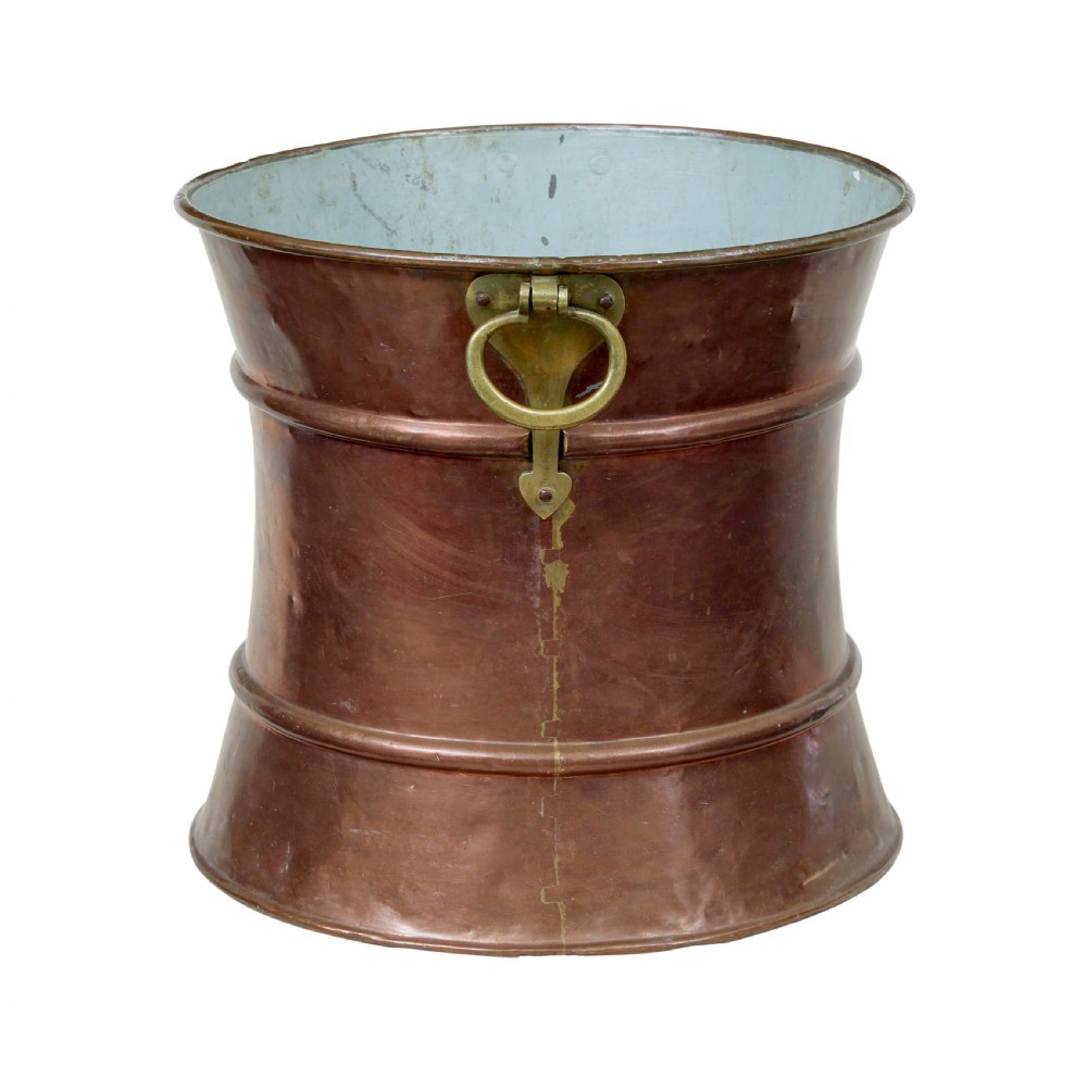 A 19th-century waist-shaped copper bucket featuring brass side handles and a tin-lined interior. View V