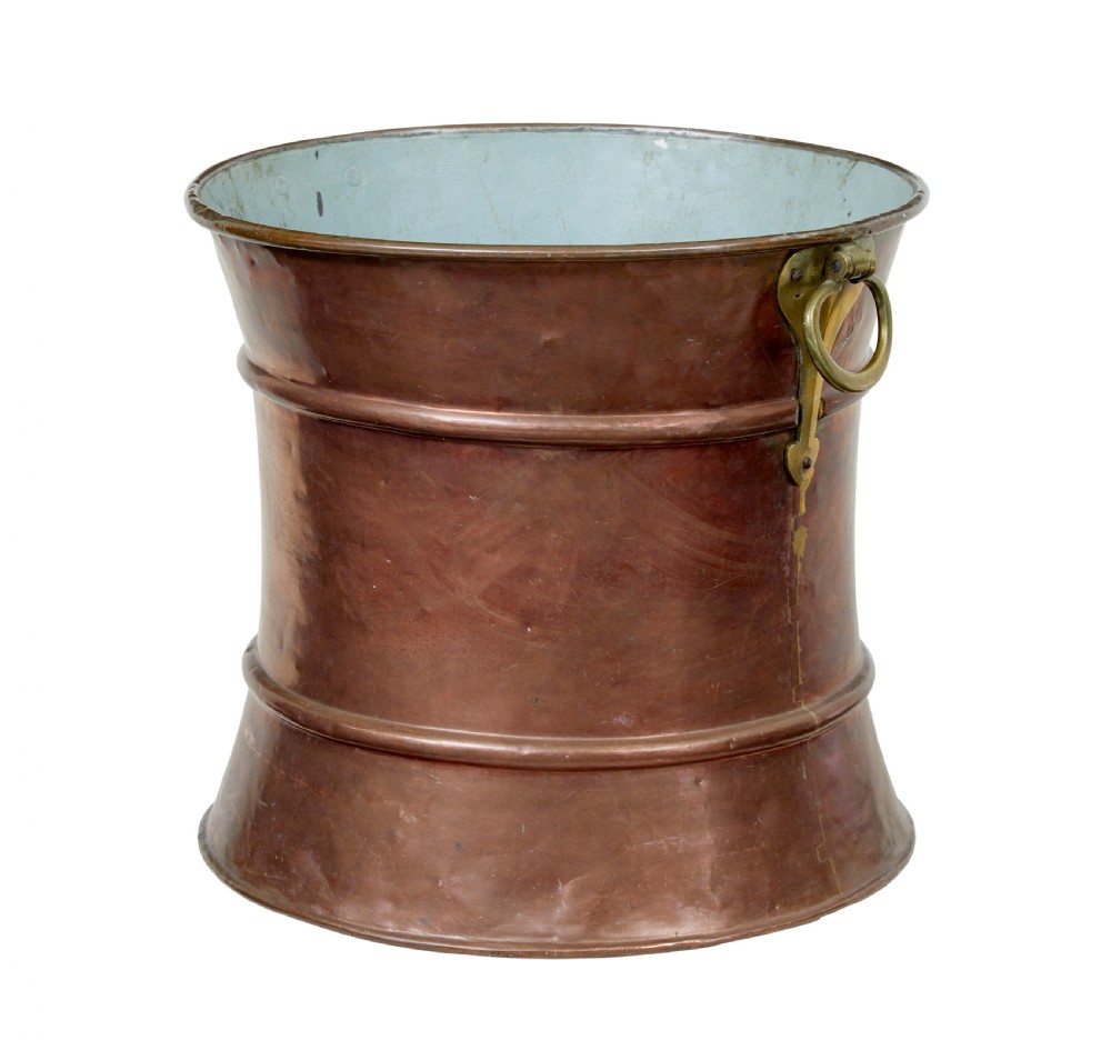 A 19th-century waist-shaped copper bucket featuring brass side handles and a tin-lined interior. View VI