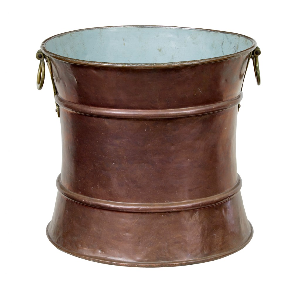 A 19th-century waist-shaped copper bucket featuring brass side handles and a tin-lined interior. View VII
