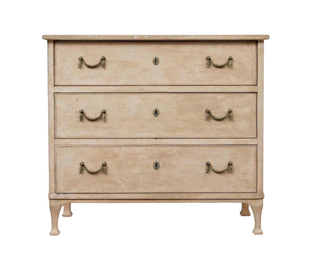 A nineteenth-century Swedish painted pine chest featuring three wide drawers with brass handles and a pale beige paint finish. View II
