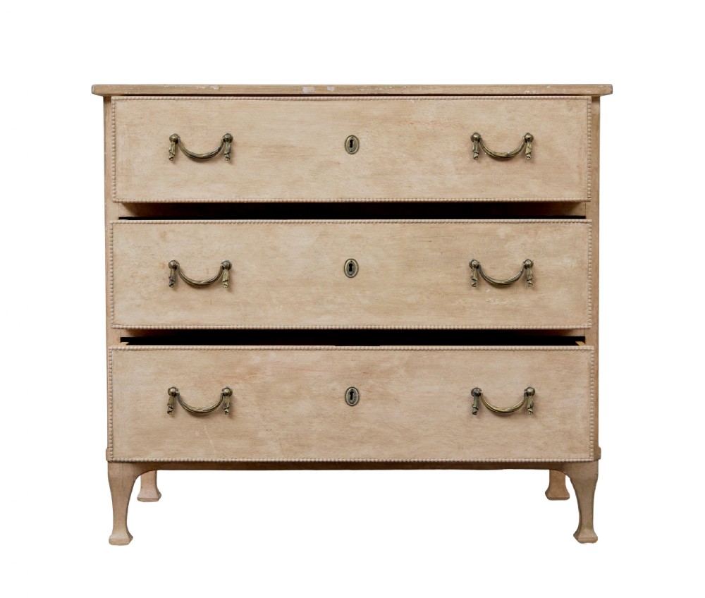 A nineteenth-century Swedish painted pine chest featuring three wide drawers with brass handles and a pale beige paint finish. View III
