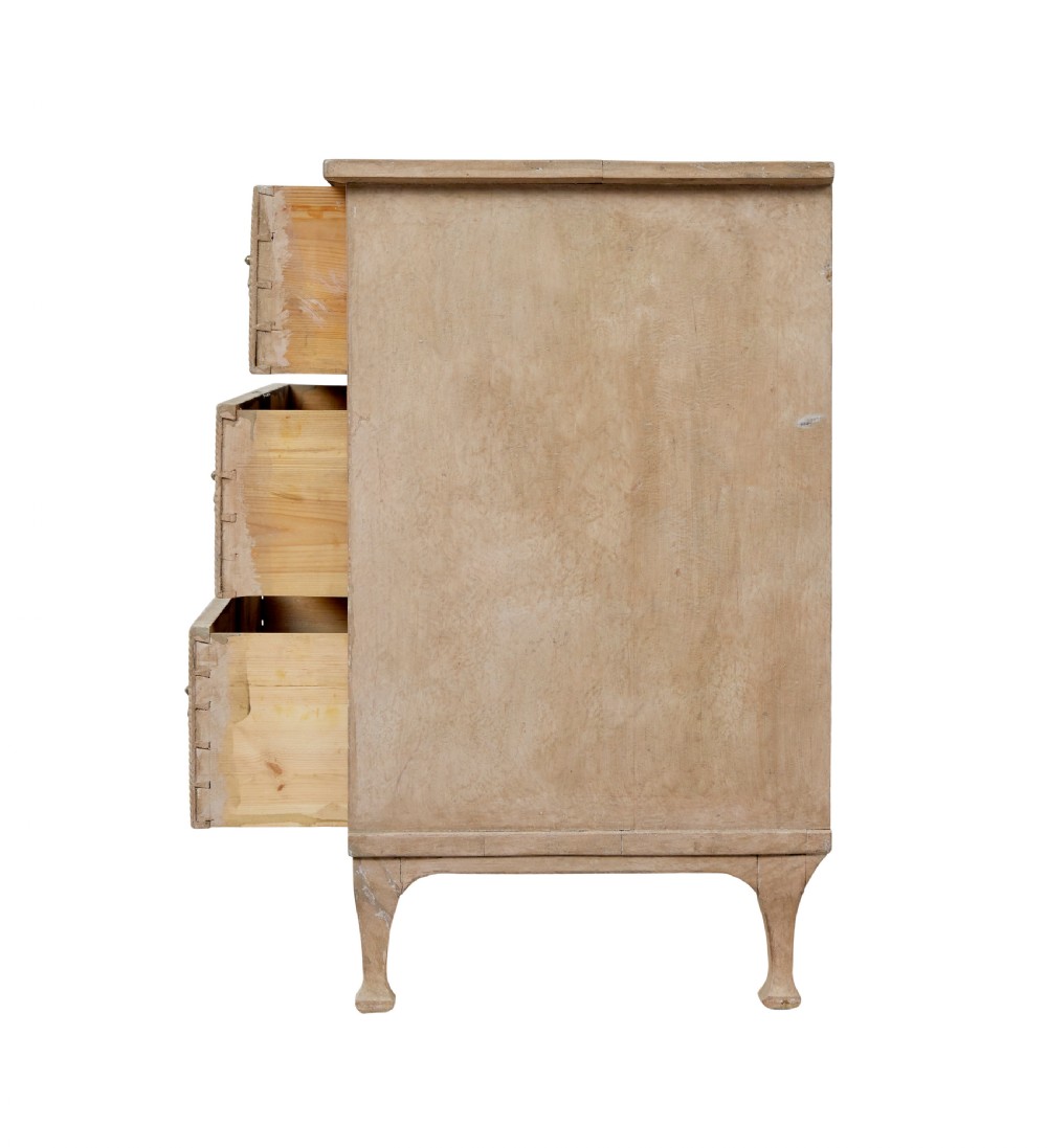 A nineteenth-century Swedish painted pine chest featuring three wide drawers with brass handles and a pale beige paint finish. View V