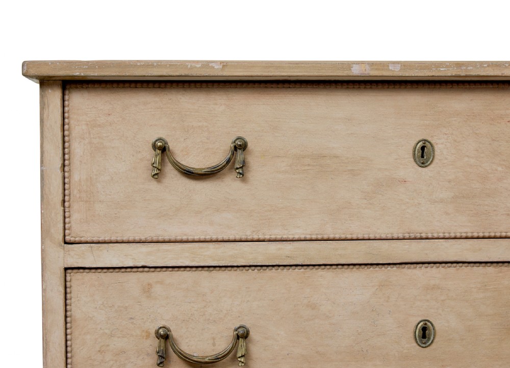 A nineteenth-century Swedish painted pine chest featuring three wide drawers with brass handles and a pale beige paint finish. View VIII