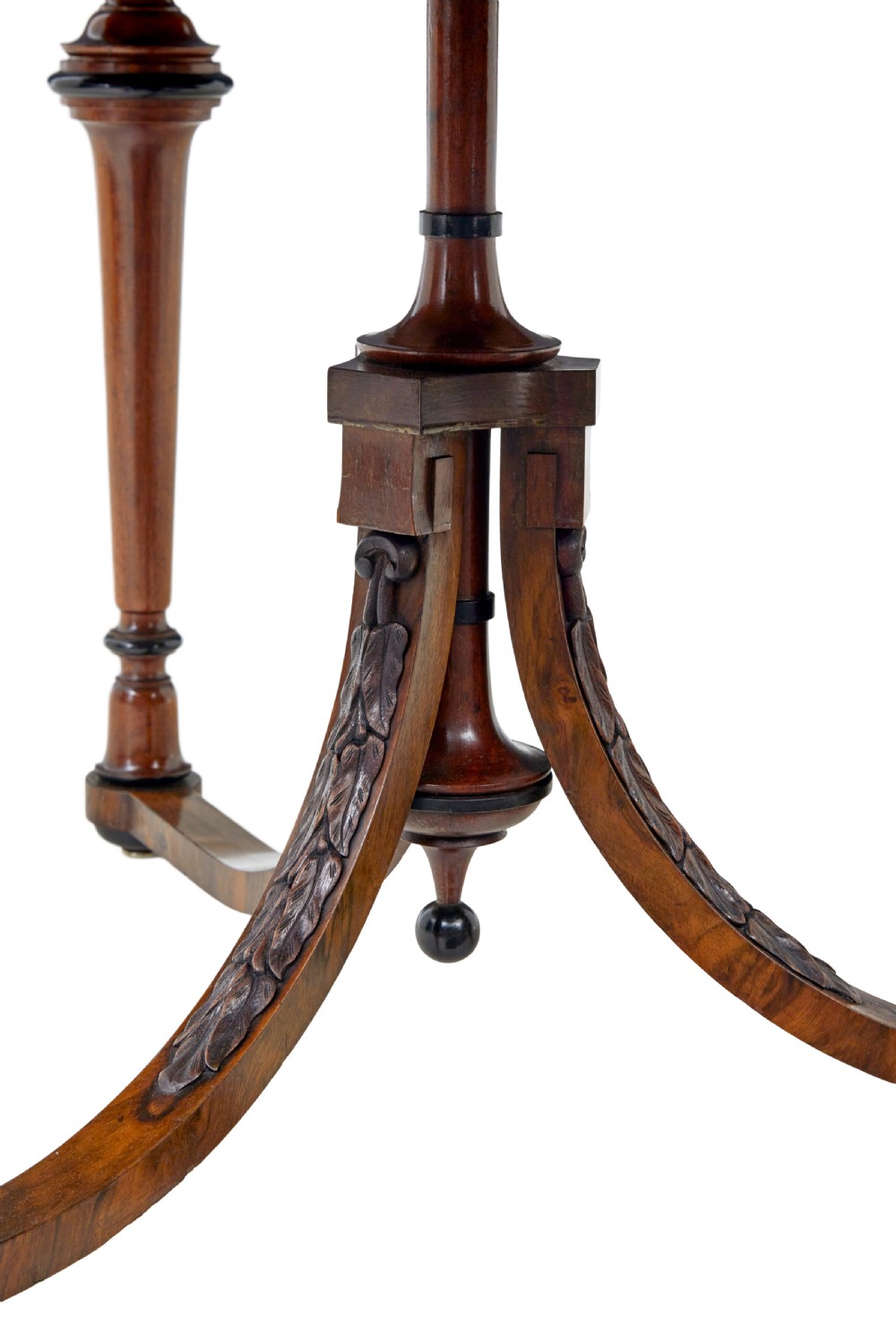 An early 20th-century circular burr walnut occasional table featuring an inlaid top, decorative apron, and three turned legs connected to a central carved triform base. View VIII