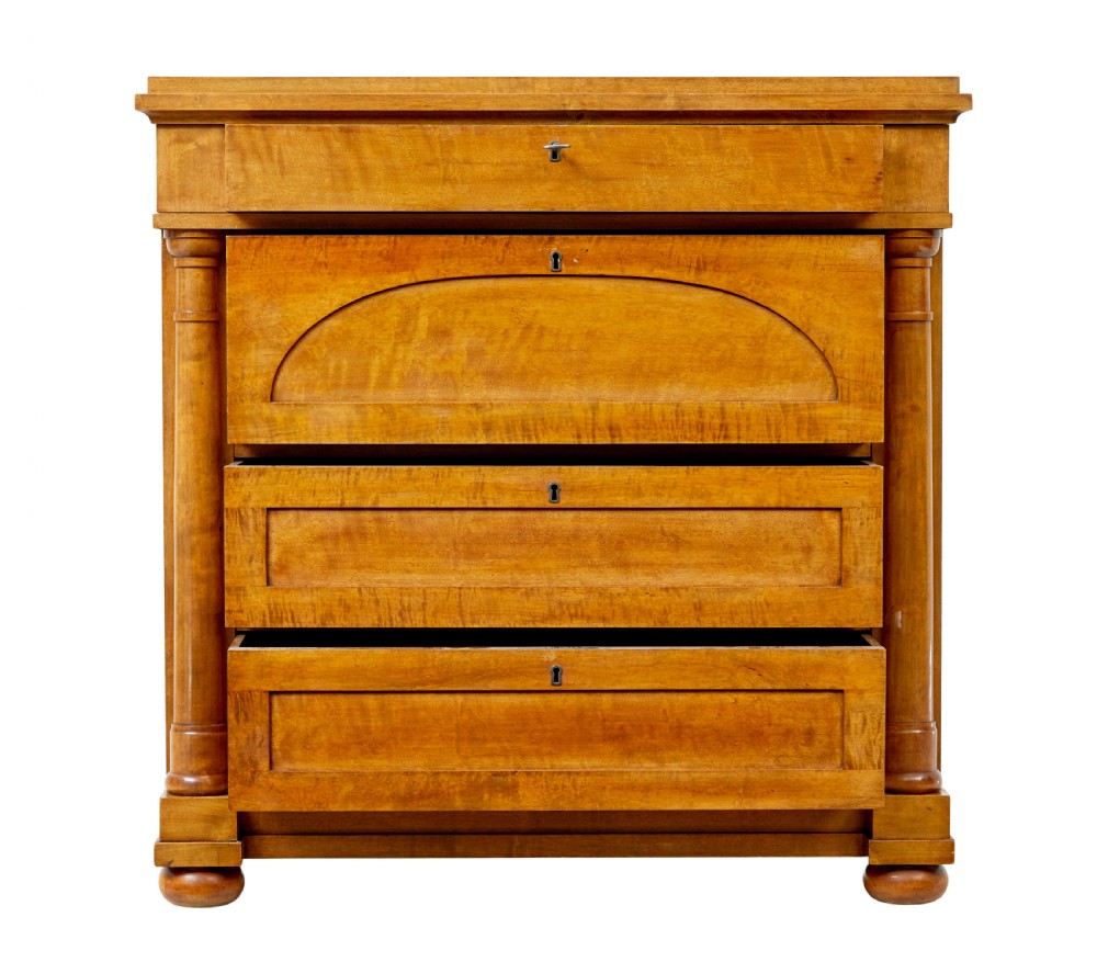 A 19th-century birch Empire Revival chest of drawers featuring architectural side columns, recessed panelled drawers, and turned bun feet. View III