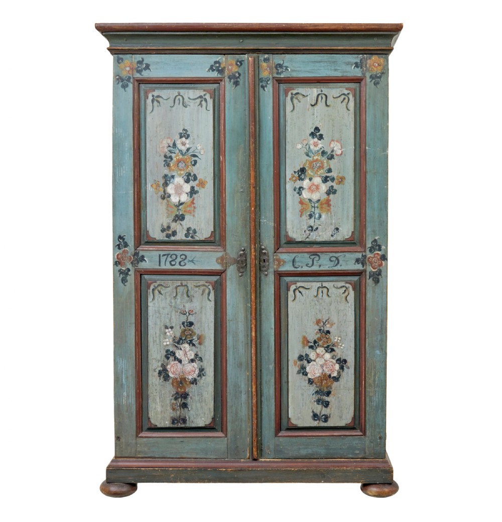 A Swedish hand-painted blue pine cupboard with panelled doors featuring floral motifs, red trim, a dated inscription from 1788, and bun feet. View II