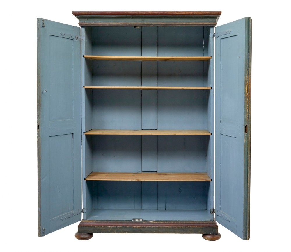 A Swedish hand-painted blue pine cupboard with panelled doors featuring floral motifs, red trim, a dated inscription from 1788, and bun feet. View III