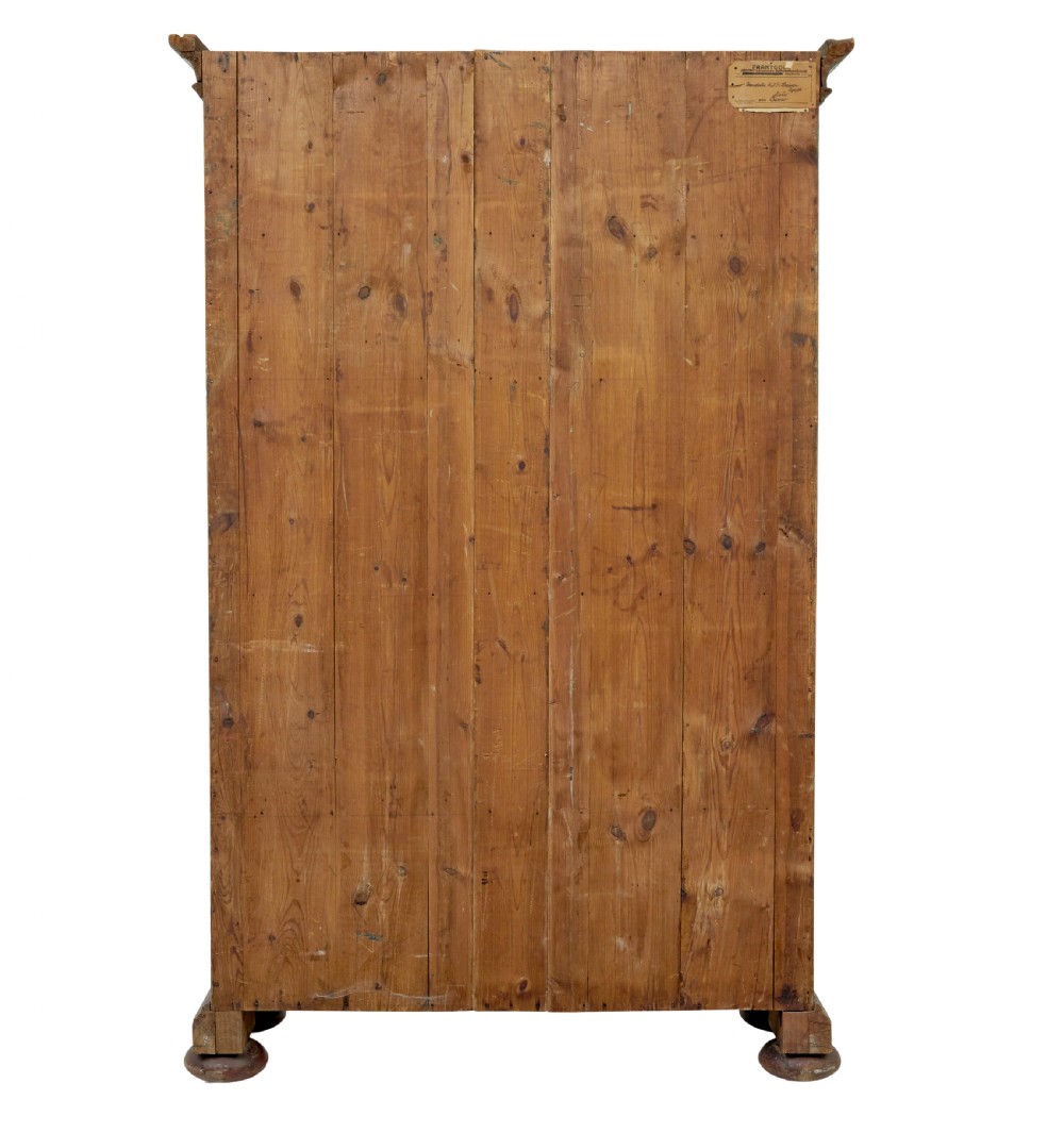 A Swedish hand-painted blue pine cupboard with panelled doors featuring floral motifs, red trim, a dated inscription from 1788, and bun feet. View V